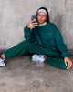 Afbeelding van Glo Sweatshirt in Bottle Green met Take Care Of Yourself Embro