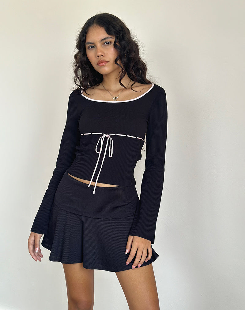 Juhye gebreide top in zwart met roze bies