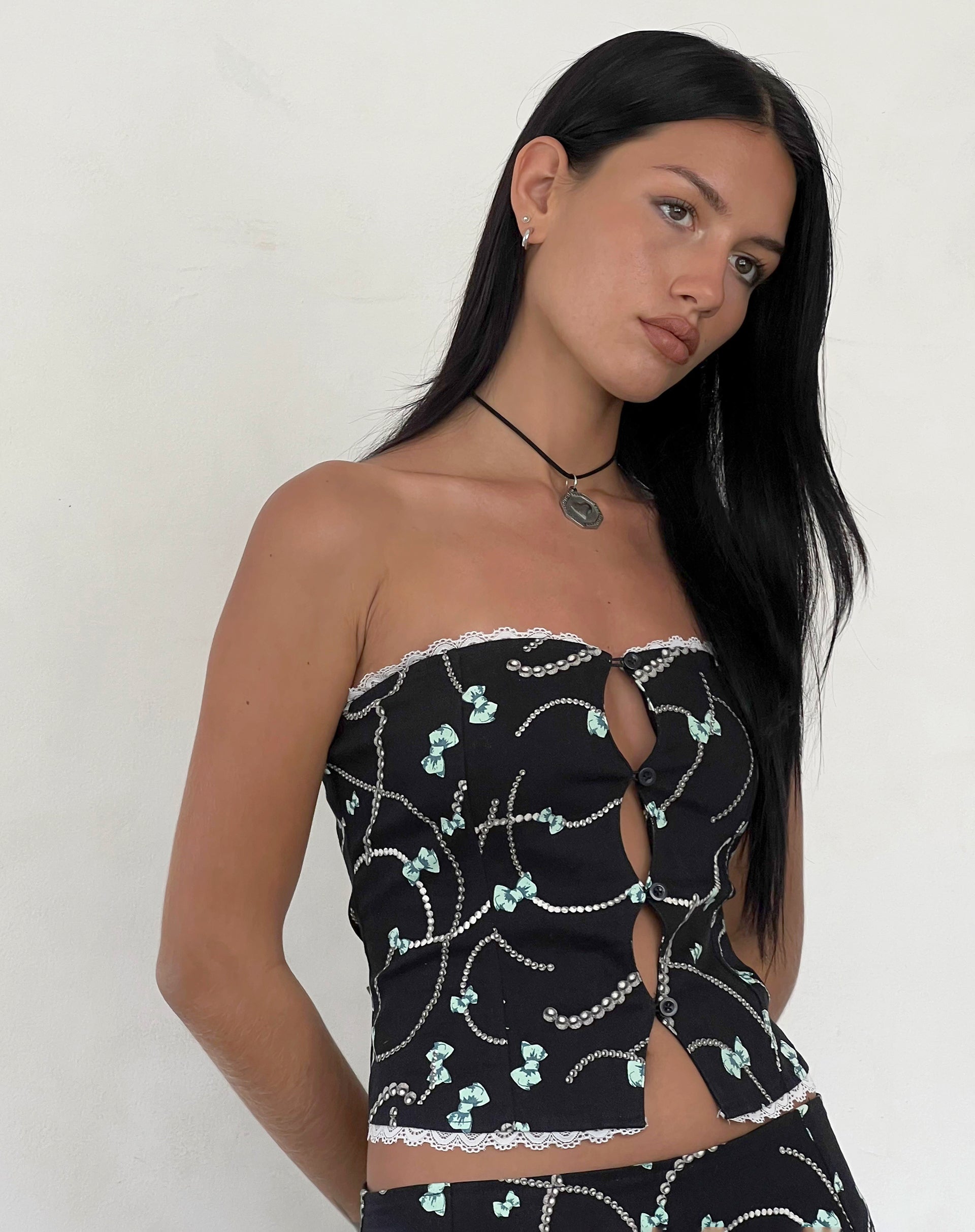 Afbeelding van Lacur Bandeau Korset in Zwart met Parel en Strikprint