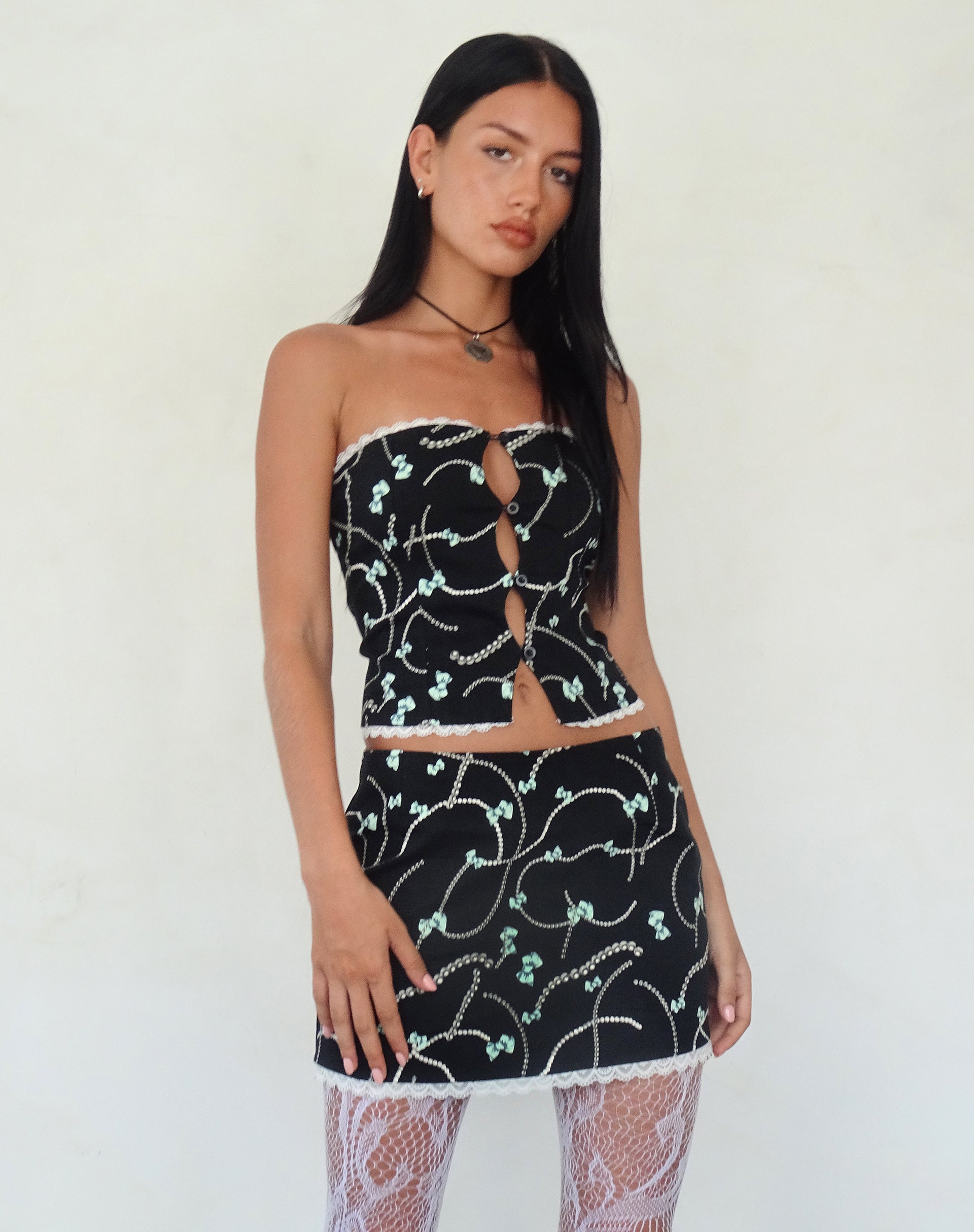 Afbeelding van Lacur Bandeau Korset in Zwart met Parel en Strikprint