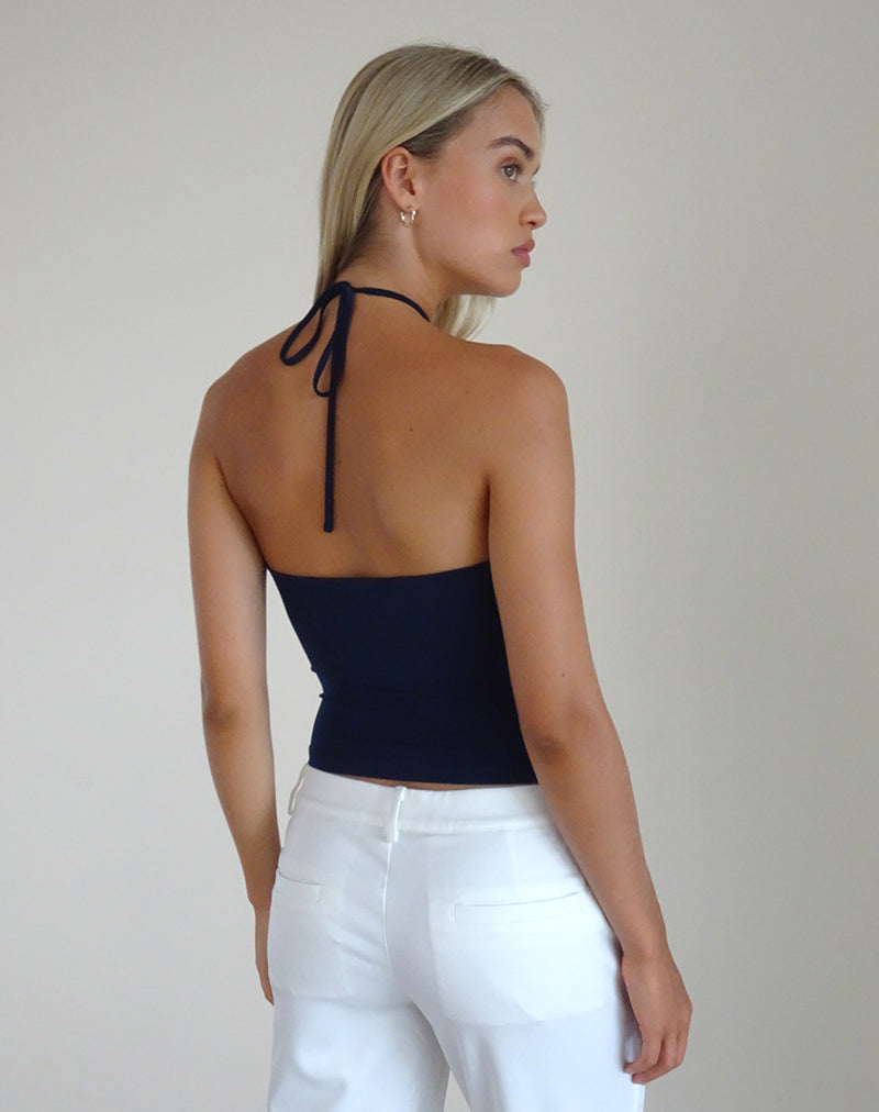 Afbeelding van Tarrina Haltertop in donkerblauw met wit rozet
