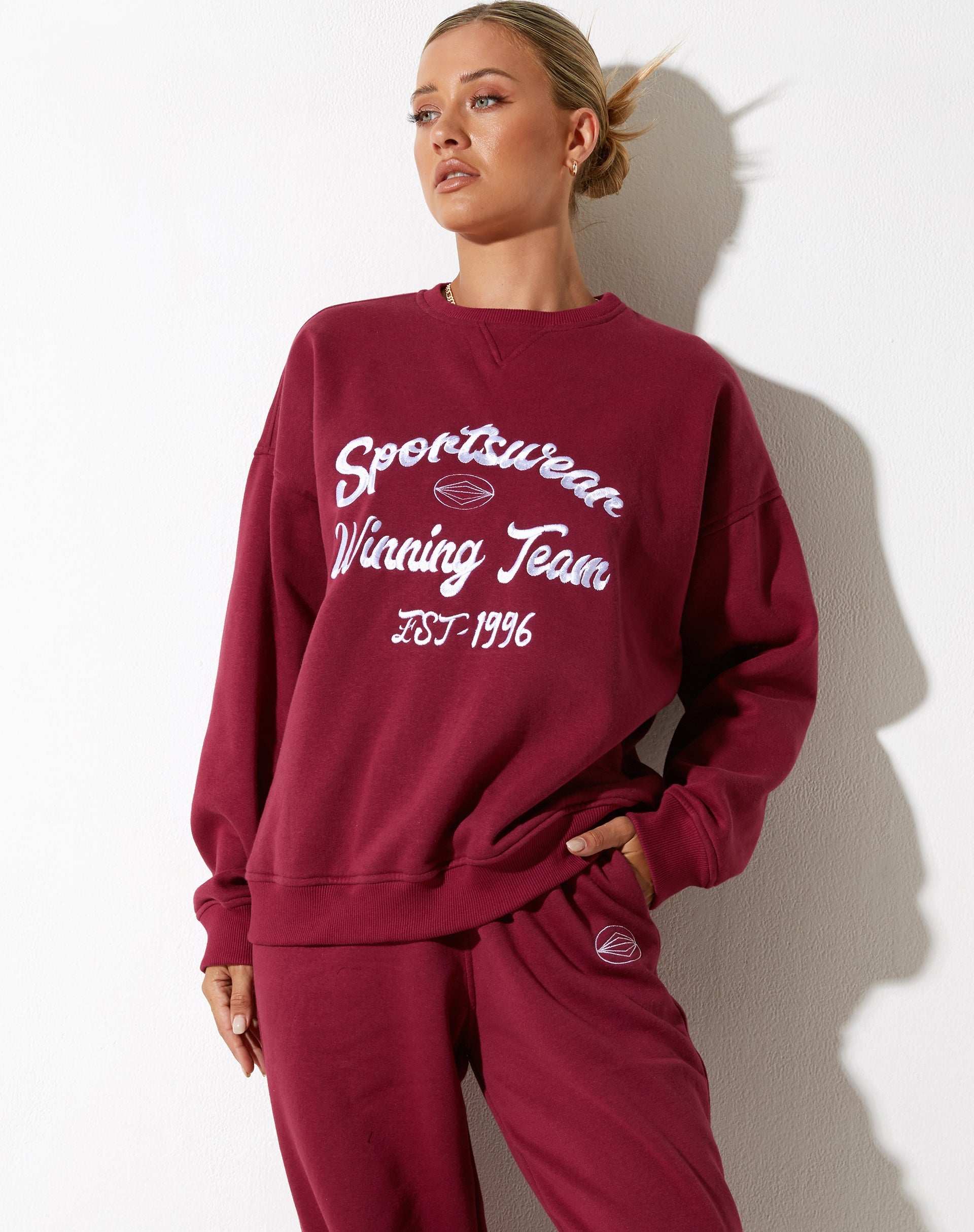Afbeelding van Glan Sweatshirt in Bourgondië met "Winnend Team" Embro