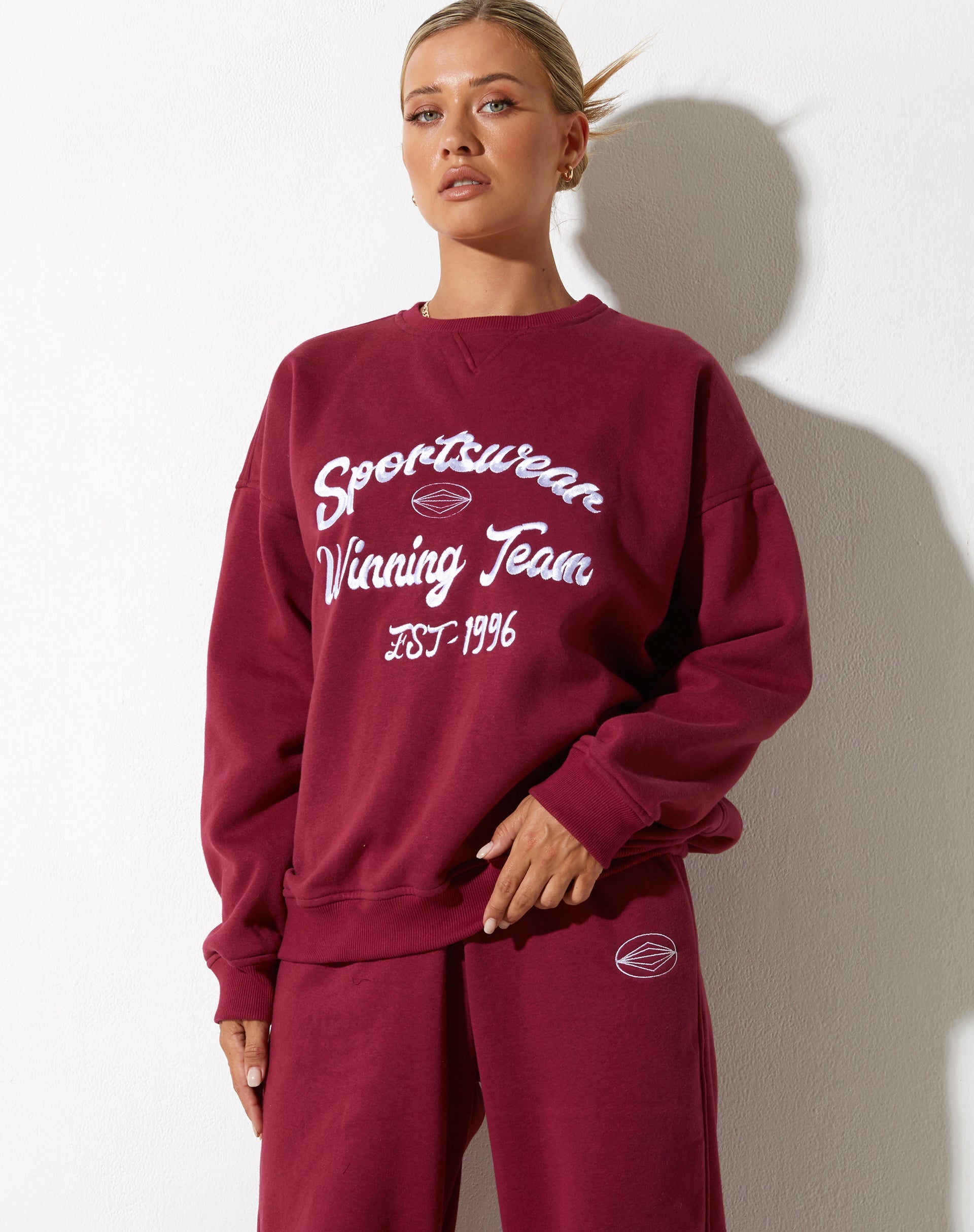 Afbeelding van Glan Sweatshirt in Bourgondië met "Winnend Team" Embro