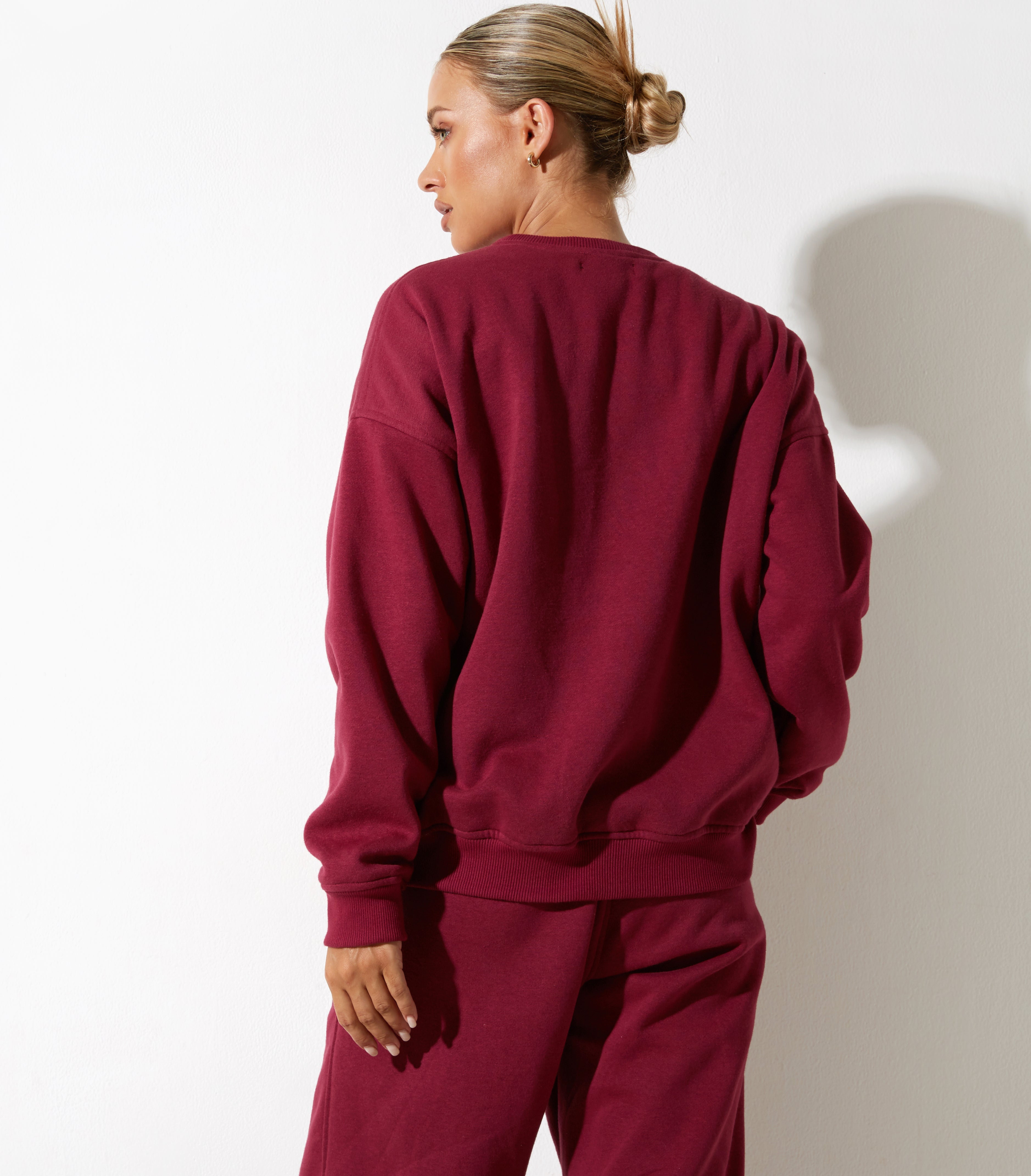 Afbeelding van Glan Sweatshirt in Bourgondië met "Winnend Team" Embro