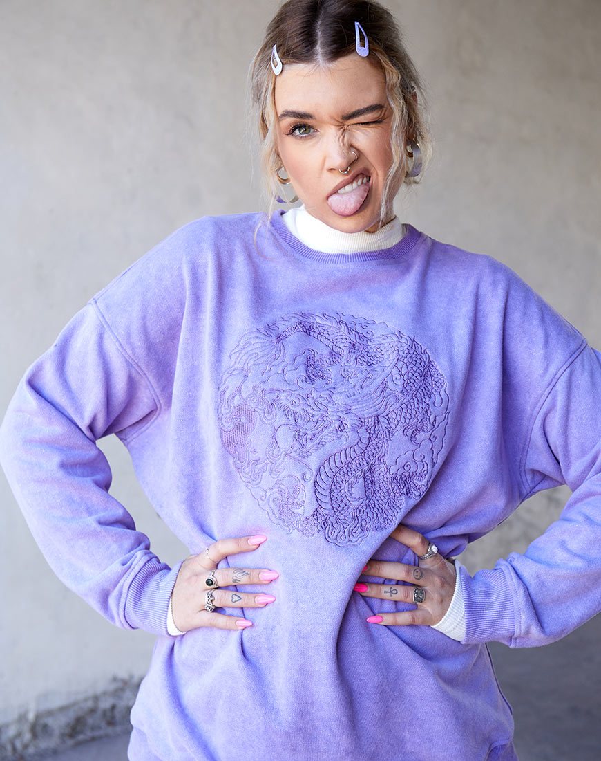 Glo Sweatshirt in lila wassing met draak borduursel