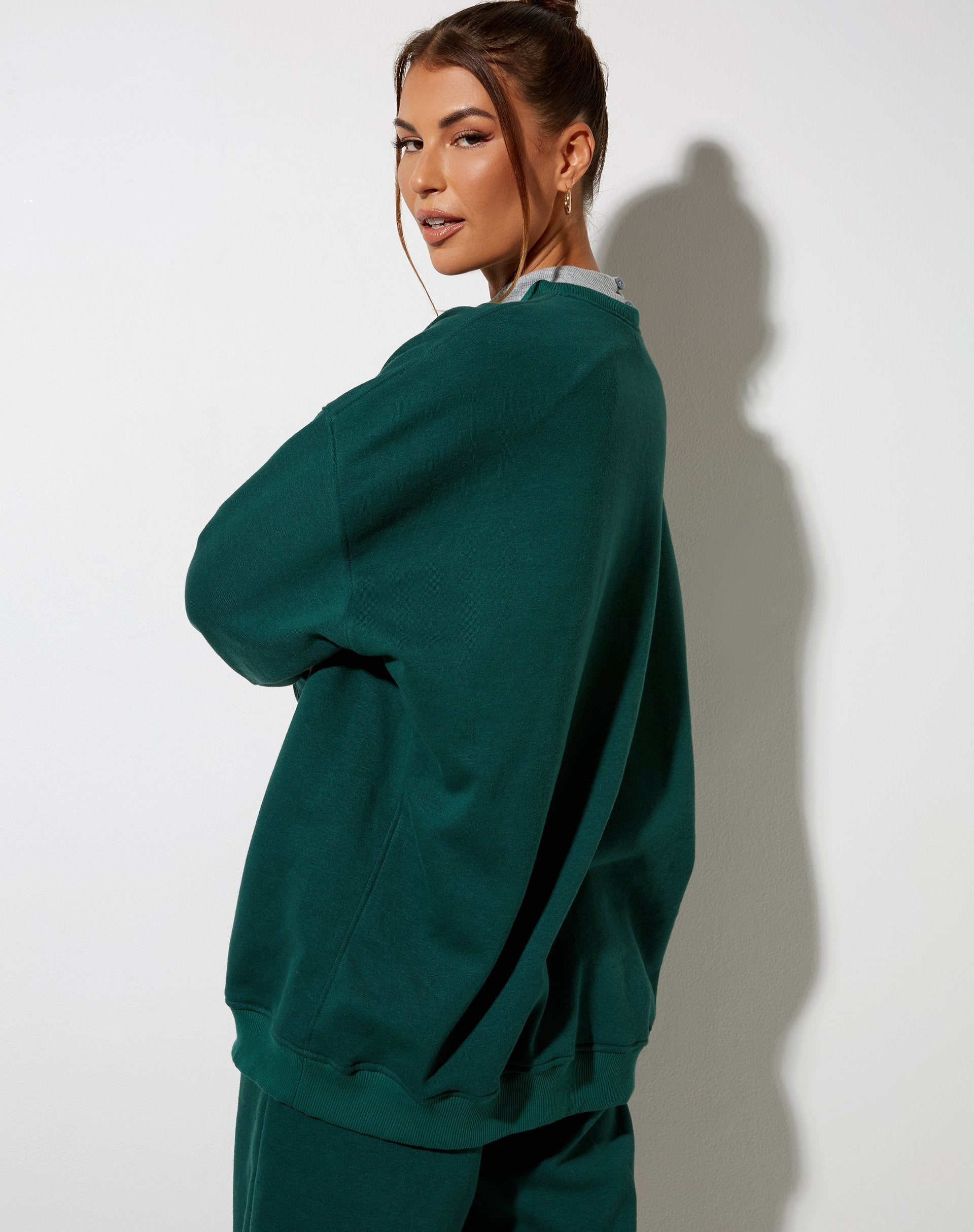 Glo Sweatshirt in flessengroen met engel borduursel in wit